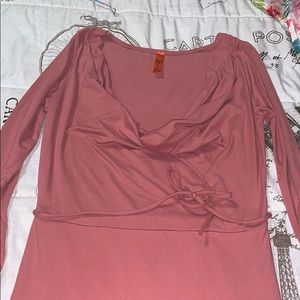 Pink dress . Low cut front .
